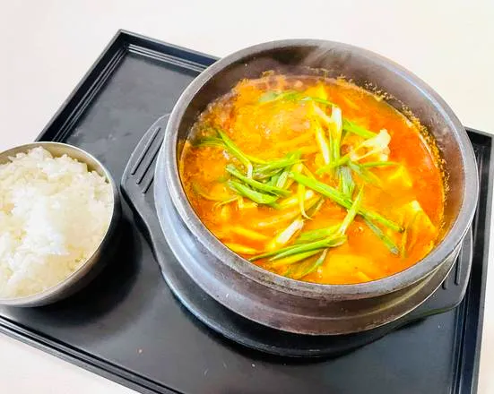 Soondubu Jjigae spicy soft tofu stew served with rice at Diane's Kitchen in Saskatoon, SK
